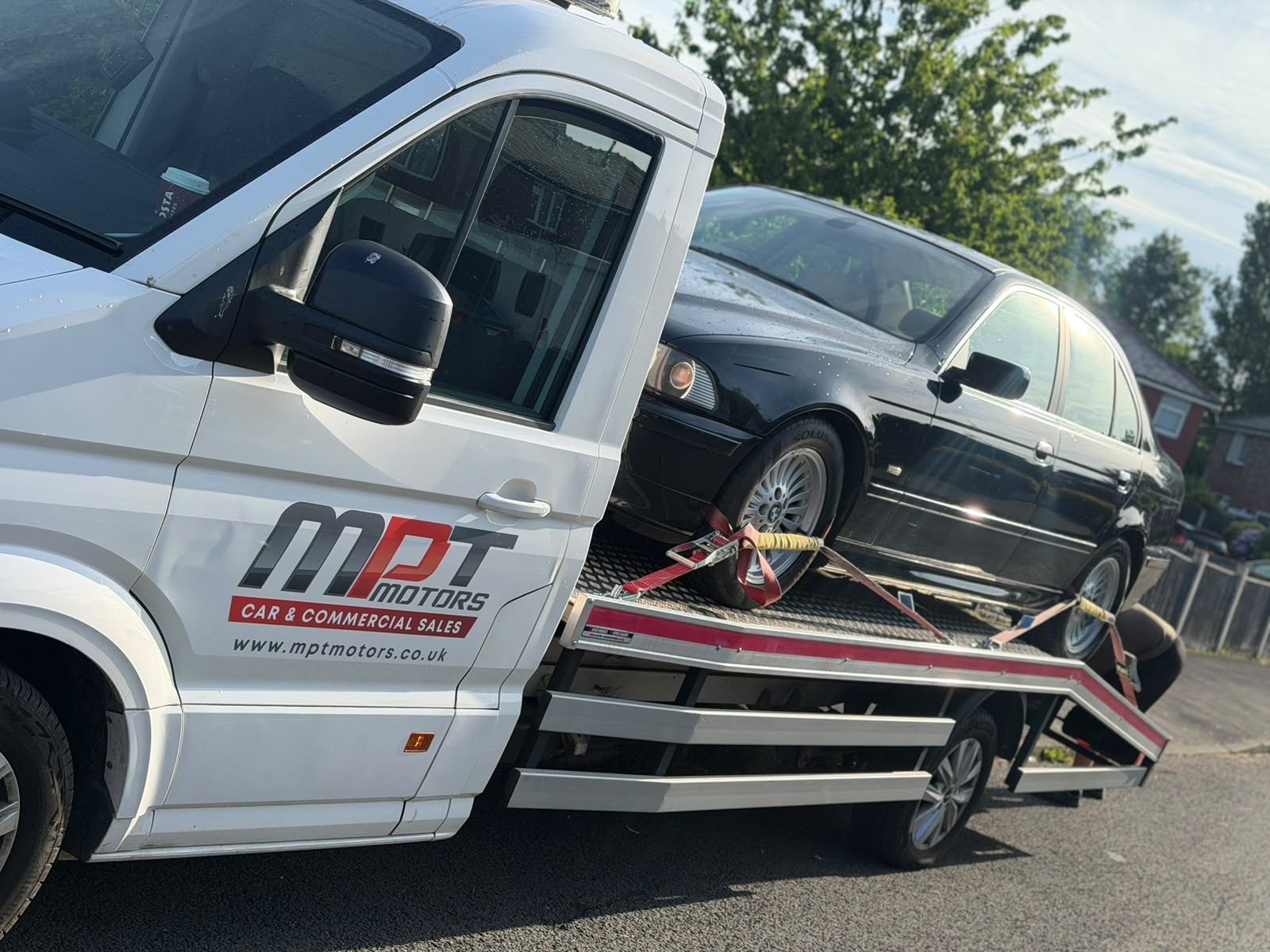 MPT Recovery branded flatbed recovering a car in Wigan